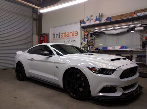 White Ford Mustang GT 5.0 with ceramic window tint installation at TintButler Waco