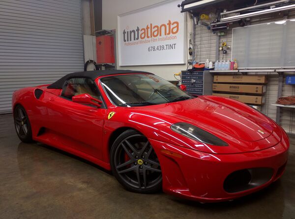 Red Ferrari F430 Spider convertible with premium window film at TintButler shop