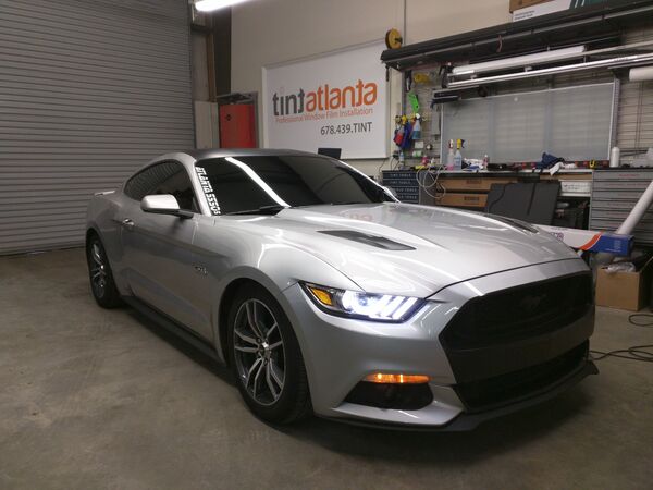 Silver Ford Mustang GT with dark ceramic window tint in Waco TX