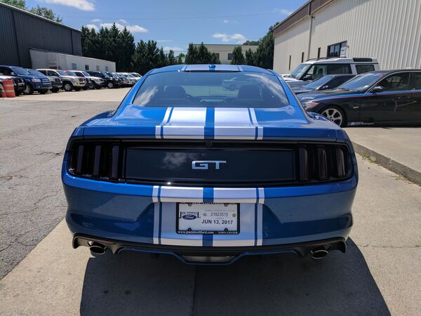 Blue Ford Mustang GT with racing stripes and tinted windows Waco