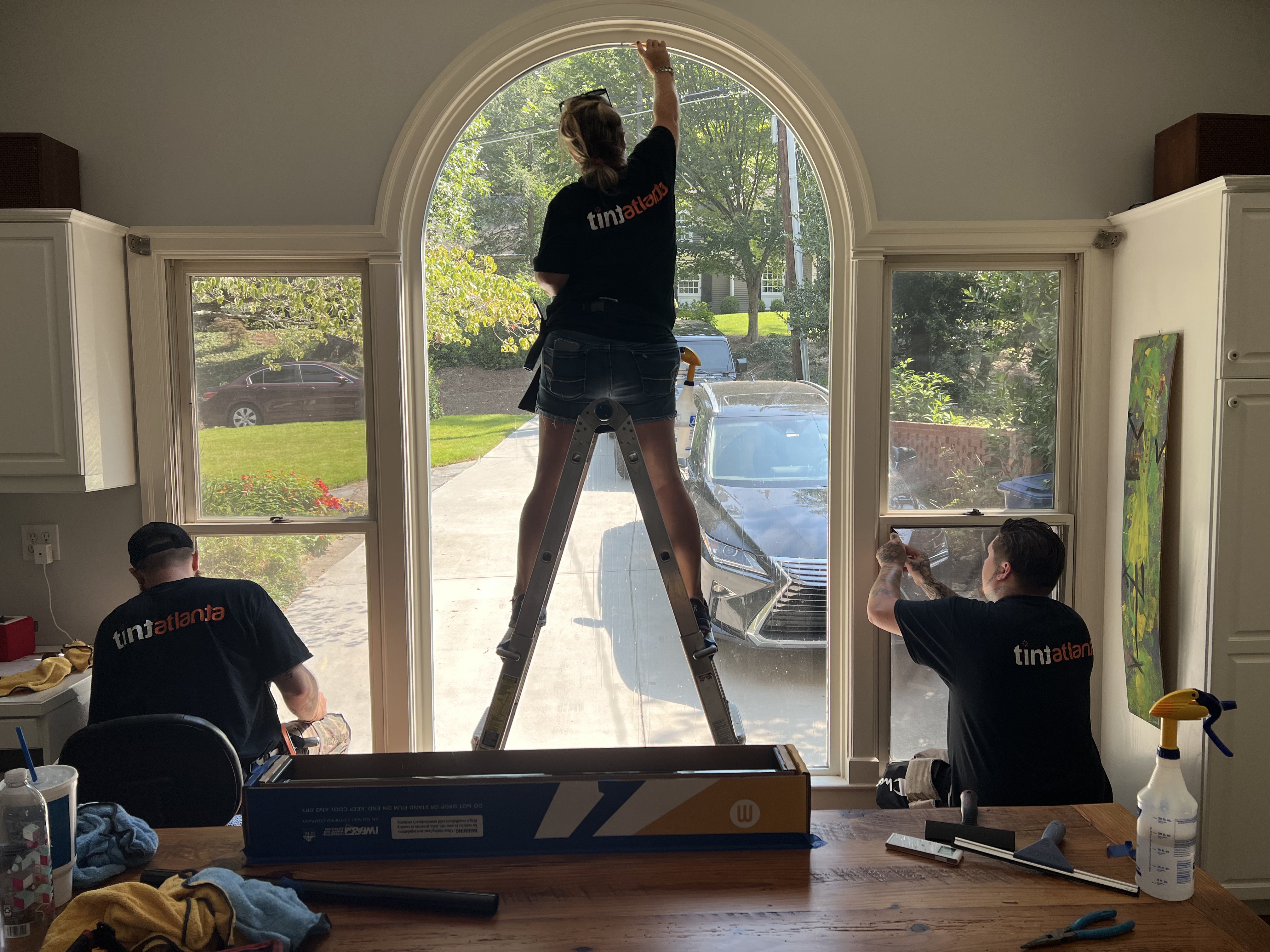 Tint Waco team installing residential window film